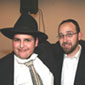 Yisroel Williger (r) has his picture taken with a FC Volunteer Yuda Reichman